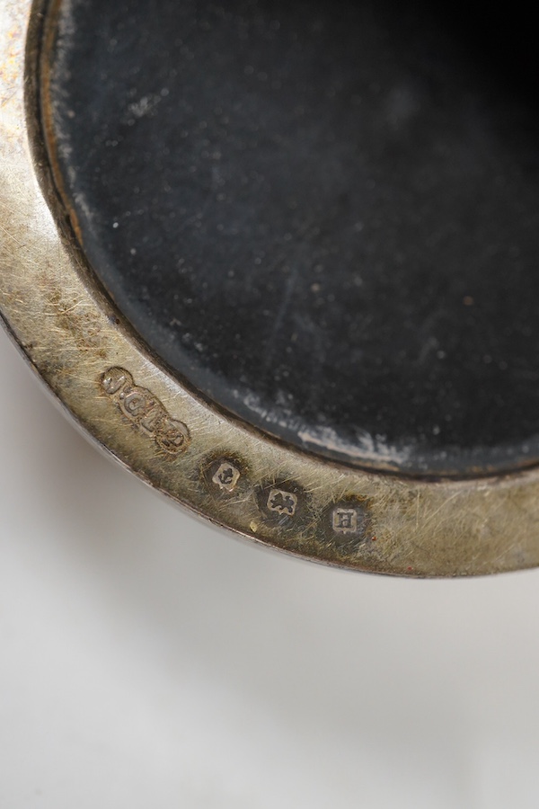 A George V seven piece silver mounted condiment set, by Joseph Gloster Ltd, Birmingham, 1932, pepper 65mm (a.f.).